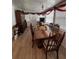 Bright dining room with a large wooden table, seasonal decor, and lots of seating at 35020 Colony Hills Dr, Zephyrhills, FL 33541