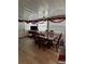 Bright dining area with natural light, laminate floors, and seating for six at 35020 Colony Hills Dr, Zephyrhills, FL 33541