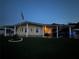 Charming single-story home featuring covered parking, nice landscaping, and a flagpole at 35020 Colony Hills Dr, Zephyrhills, FL 33541