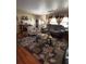 Inviting living room featuring modern furniture, decorative rug, and ample natural light at 35020 Colony Hills Dr, Zephyrhills, FL 33541