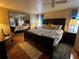 Cozy main bedroom with dark furniture, unique bedding, and mirrored closet doors at 35020 Colony Hills Dr, Zephyrhills, FL 33541