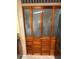 Stylish pantry doors with decorative frosted glass and wooden trim at 35020 Colony Hills Dr, Zephyrhills, FL 33541