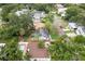 A captivating aerial view showcases a charming single-story home with lush greenery and a well-defined property line at 3503 W Palmira Ave, Tampa, FL 33629