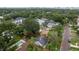 An expansive aerial shot reveals a quaint home encircled by established landscaping and highlighted by a distinct property line at 3503 W Palmira Ave, Tampa, FL 33629