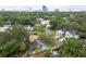 A striking aerial perspective displays a cozy home nestled among mature trees, complete with a clearly marked property boundary at 3503 W Palmira Ave, Tampa, FL 33629