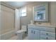 Bright bathroom featuring a tiled shower and tub with vanity at 3503 W Palmira Ave, Tampa, FL 33629