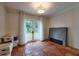 Bedroom with tile floors, double doors leading to outside, paneled walls, and a modern light fixture at 3503 W Palmira Ave, Tampa, FL 33629
