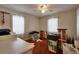 Bedroom with hardwood floors, white trim, two windows for natural light, and a ceiling fan at 3503 W Palmira Ave, Tampa, FL 33629