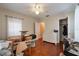 Bedroom with hardwood floors, white trim, a window for natural light, a ceiling fan, and closet at 3503 W Palmira Ave, Tampa, FL 33629
