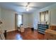 Spacious bedroom with hardwood floors, a ceiling fan, and natural light from a window at 3503 W Palmira Ave, Tampa, FL 33629