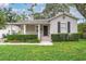 Charming single-story home with a well-manicured lawn and classic architectural details at 3503 W Palmira Ave, Tampa, FL 33629