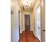 View of the hallway featuring wood flooring and access to other rooms at 3503 W Palmira Ave, Tampa, FL 33629