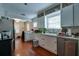 Kitchen features include hardwood floors, white cabinets, stainless steel appliances, and plenty of natural light at 3503 W Palmira Ave, Tampa, FL 33629