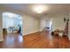An open-concept living space featuring gleaming wood floors and plenty of natural light at 3503 W Palmira Ave, Tampa, FL 33629