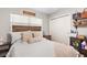 Inviting bedroom with a wood-frame bed, soft lighting, and stylish decor at 3622 W Mullen Ave, Tampa, FL 33609