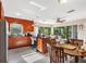 Open concept kitchen with natural lighting, granite countertops, stainless steel appliances, and a breakfast nook at 3622 W Mullen Ave, Tampa, FL 33609