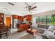 Open concept kitchen flows into a naturally lit living area with modern appliances and granite countertops at 3622 W Mullen Ave, Tampa, FL 33609