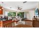 Naturally lit living space featuring a large seating area and granite countertops, creating a perfect blend of comfort and style at 3622 W Mullen Ave, Tampa, FL 33609