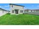 A spacious green backyard with a neutral colored home at 3655 Moscato Dr, Brooksville, FL 34602