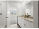 Modern bathroom with double vanity, granite counters, and plenty of natural light at 3655 Moscato Dr, Brooksville, FL 34602