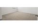 Bedroom featuring neutral carpet, base trim, and one window at 3655 Moscato Dr, Brooksville, FL 34602