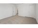 Bedroom with neutral carpet, closet, and doorway at 3655 Moscato Dr, Brooksville, FL 34602