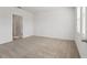 Clean, neutral bedroom with carpet flooring and ample natural light from the window at 3655 Moscato Dr, Brooksville, FL 34602