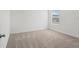 A cozy bedroom featuring plush carpeting, a bright window, and neutral tones at 3655 Moscato Dr, Brooksville, FL 34602