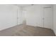 Bedroom with neutral carpet, closet, and doorway at 3655 Moscato Dr, Brooksville, FL 34602