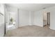 Spacious bedroom with carpet, connecting to bathroom and living area at 3655 Moscato Dr, Brooksville, FL 34602