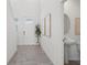 Entryway featuring tile flooring and a powder room at 3655 Moscato Dr, Brooksville, FL 34602
