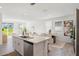 Bright, open kitchen with a central island, stainless steel appliances, and lots of natural light at 3655 Moscato Dr, Brooksville, FL 34602