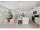 Modern, open concept kitchen and dining room featuring an island with bar stool seating at 3655 Moscato Dr, Brooksville, FL 34602