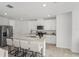 Stylish kitchen with a central island, bar seating, and modern stainless steel appliances at 3655 Moscato Dr, Brooksville, FL 34602
