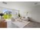 Living room filled with light with large sliding doors leading to the yard at 3655 Moscato Dr, Brooksville, FL 34602