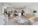 Stylish living room with a view into the kitchen and dining area, perfect for entertaining guests at 3655 Moscato Dr, Brooksville, FL 34602