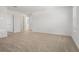 Spacious loft area with neutral carpet and abundant natural light at 3655 Moscato Dr, Brooksville, FL 34602