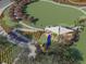 Aerial view of modern playground with slide and sunshade in new community at 3655 Moscato Dr, Brooksville, FL 34602