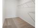 Walk-in closet featuring carpeted floors and metal shelving at 3655 Moscato Dr, Brooksville, FL 34602