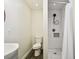 Charming bathroom with modern sink, updated fixtures, and a clean shower with a white tile surround at 3850 Carioca Rd, Holiday, FL 34691
