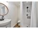 Nicely updated bathroom featuring a modern sink, sleek fixtures, and a stylish shower with new tile at 3850 Carioca Rd, Holiday, FL 34691