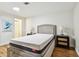 Bright bedroom with a comfortable bed, stylish side tables, and a soothing atmosphere at 3850 Carioca Rd, Holiday, FL 34691