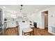 Modern kitchen with an island, stainless steel appliances, and designer tile backsplash at 3850 Carioca Rd, Holiday, FL 34691