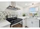Bright kitchen with stainless steel range and stone backsplash at 3850 Carioca Rd, Holiday, FL 34691