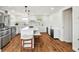 Modern kitchen with an island, stainless steel appliances, and designer tile backsplash at 3850 Carioca Rd, Holiday, FL 34691