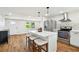 Charming kitchen with stainless appliances, counter seating and lots of natural light at 3850 Carioca Rd, Holiday, FL 34691
