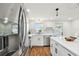 This kitchen features stainless appliances, ample counter space and hardwood floors at 3850 Carioca Rd, Holiday, FL 34691