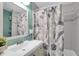 Bathroom with a modern sink, vanity, stylish shower curtain, and tile surround at 4044 56Th N Ave, St Petersburg, FL 33714