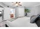 Bright bedroom featuring a ceiling fan, TV, and ensuite bathroom for added convenience at 4044 56Th N Ave, St Petersburg, FL 33714