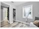 Small bedroom with a window, closet, and ensuite bathroom at 4044 56Th N Ave, St Petersburg, FL 33714